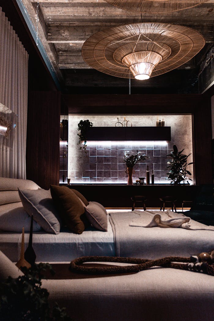 Elegant modern bedroom interior with luxury design elements and ambient lighting, featuring a stylish light fixture.